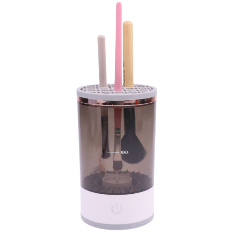 Electric makeup brush cleaner spinning a brush