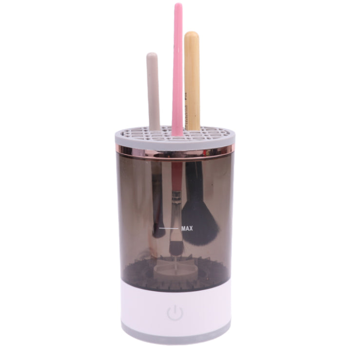 Electric makeup brush cleaner spinning a brush