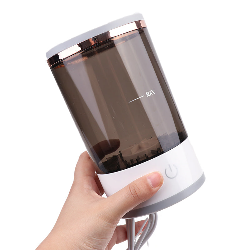 Electric makeup brush cleaner spinning a brush